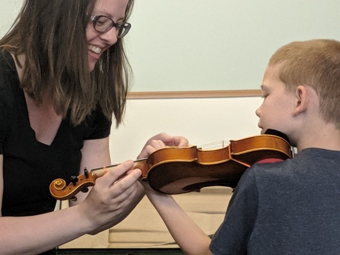 Expert Suzuki Violin Coach Teaching Young Child
