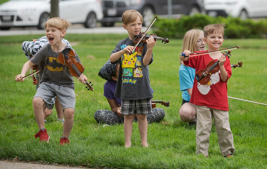 Elementary Grade Children Practicing Violin Outside at BW's Suzuki Music Class