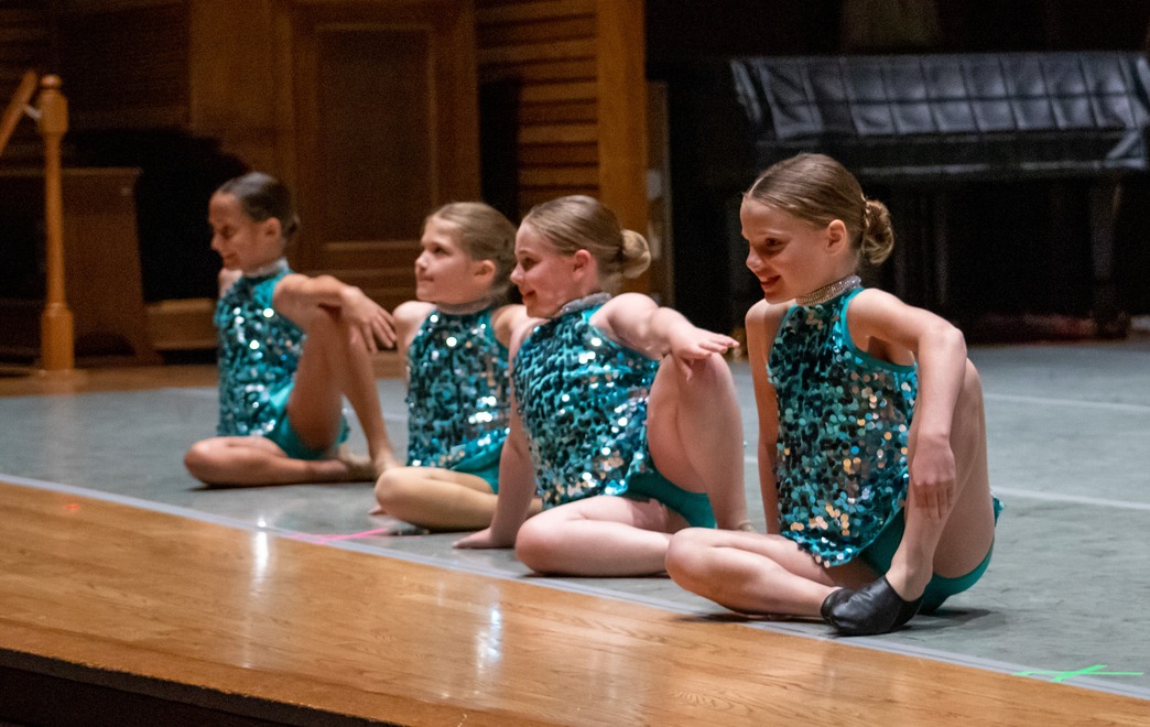 Four Young Dancers Posting on the Stage During the Early Learners Class